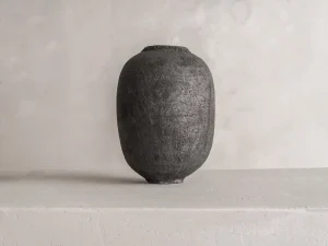 handmade black ceramic vase, by French artisan Karen Swami, natural, cracked surface, inspired by naked clay textures, perfect for luxury ceramic home decor and artisan pottery collections
