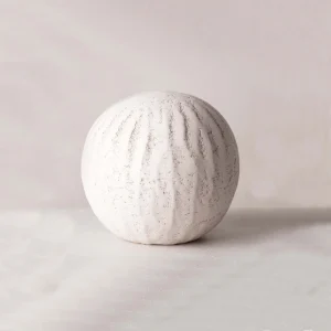 handmade ceramic sculpture by Karen Swami, crafted in Paris atelier, naked clay texture, round shape highlight, French pottery design, luxury ceramic artistry