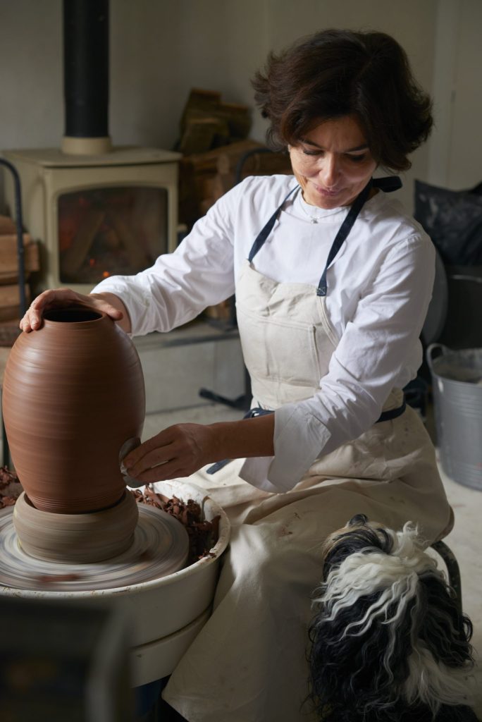 Karen Swami, French ceramist sculpting art ceramics in her pottery atelier in Locquirec, Brittany, France