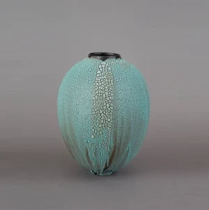 handcrafted blue ceramic vase, features delicate crackle glaze, graceful silhouette, an elegant design object for modern interiors, luxury unique decoration, handmade in French atelier