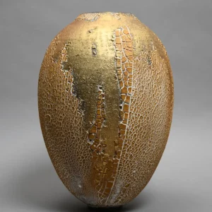 vase-klimt-ceramic-form-ovoid-gift-luxury-creation-exclusive-golden-brown-cracked-tone hand-thrown French pottery vase, features a cracked gold glaze, with earthy undertones, giving it a bold and timeless presence, sculptural object that blends French ceramic art with natural elegance, perfect for luxury ceramic home decor, design by ceramist Karen Swami in France, piece unique